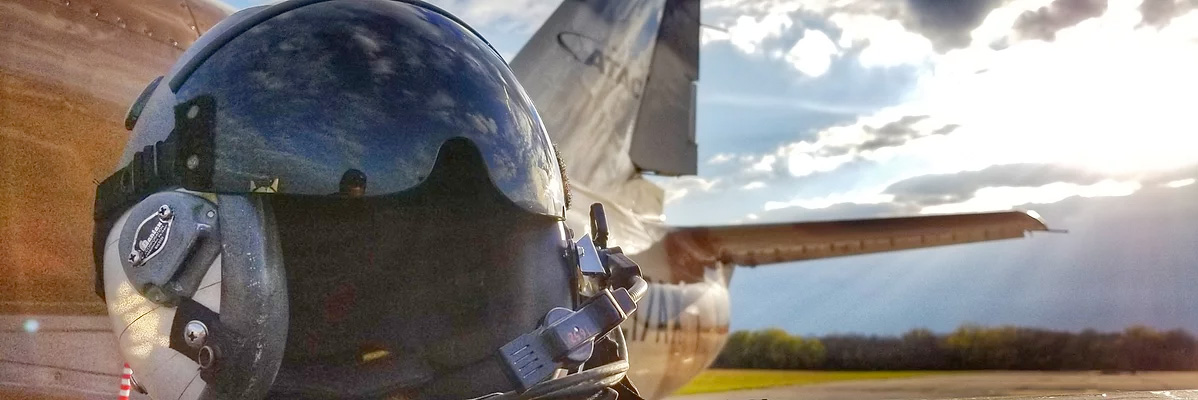 Image of helmet in front of plane